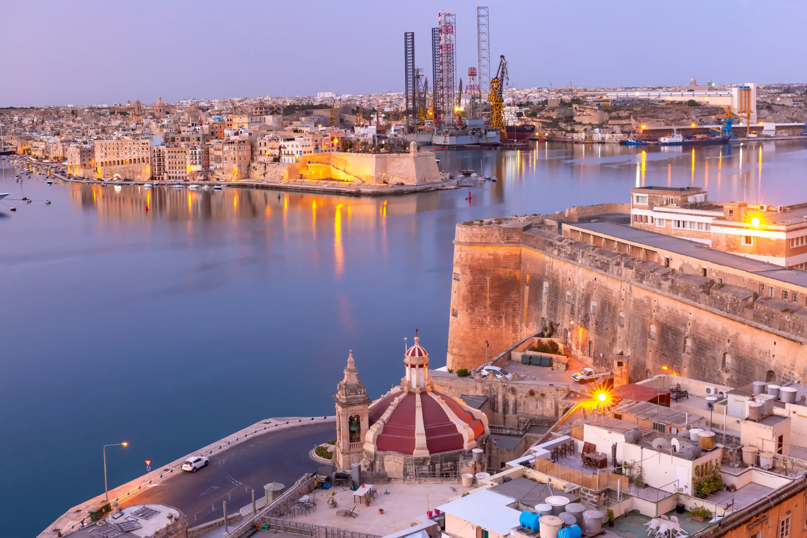Grand Harbor and Senglea - one of Three cities, Church of Our Lady of Liesse on Quay of Valletta at dawn, Malta.. Grand Harbor of Valletta at dawn. Malta.
